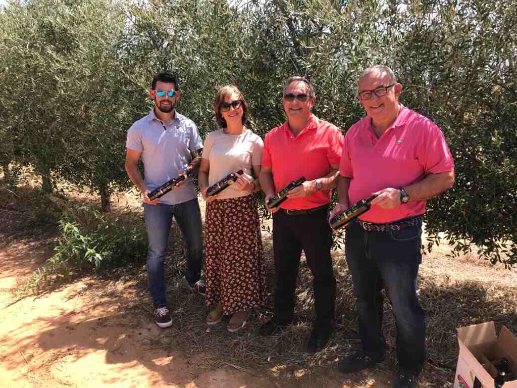 The 4th generation Delgado family in their arbequino olive grove. From left to right: Diego, Alicia, Esteban y Jesús (the last 3 are siblings).