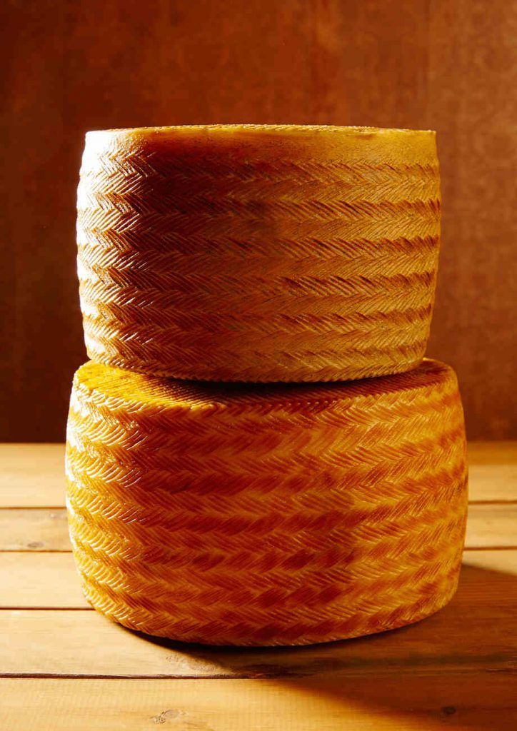 Whole wheels of Manchego cheese