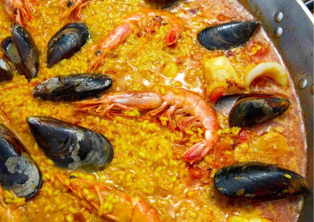 Seafood paella in a paellera