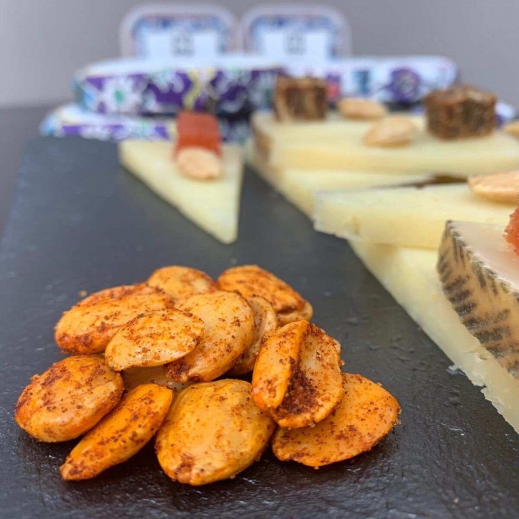 Delicious Deliart Marcona Almonds paired with cheese and quince paste