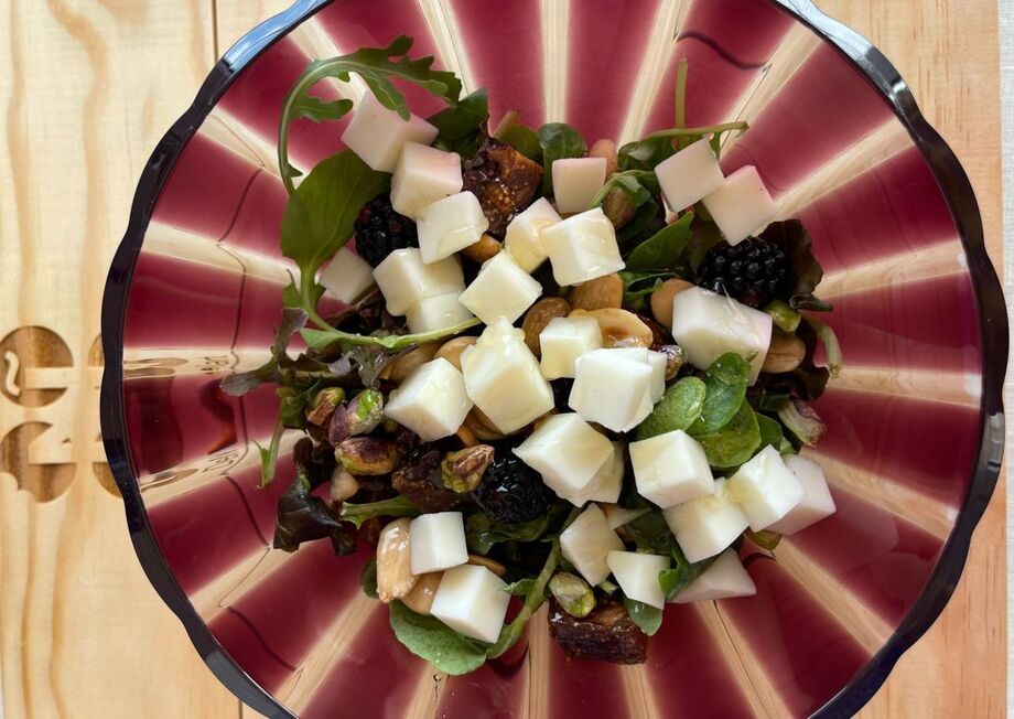 Salad with Deliart Murcia al Vino cheese, fig cake, almonds, pistachios, blackberries and honey.