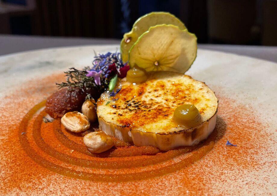 Delectable goat cheese roll, melted with candied Marcona almonds and paired with fig cake.