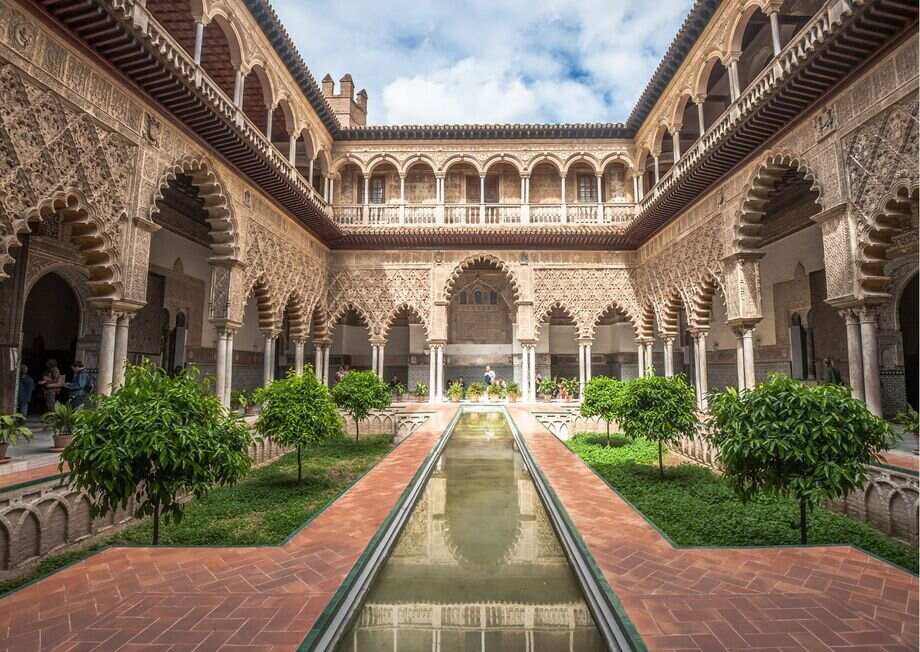 The Royal Alcazar of Seville, showcasing its intricate Moorish architecture.