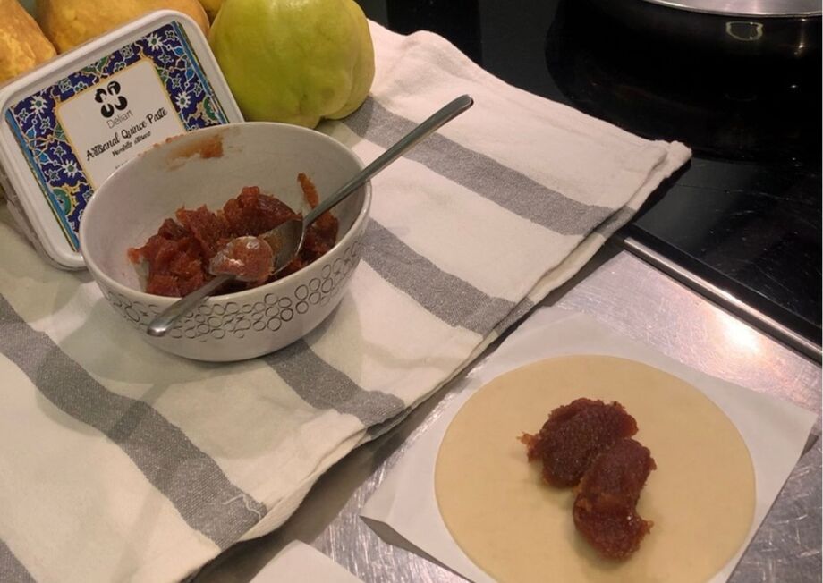 A spoonful of quince paste is placed in the center.