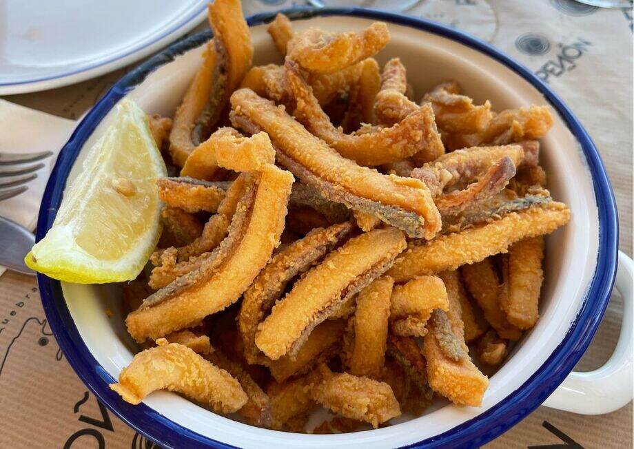 It's quite common to enjoy vermouth accompanied by delicious rabas de calamar.