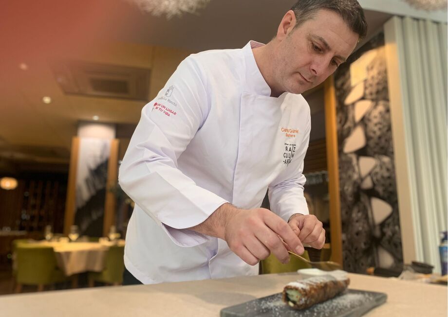 Chef Carlos Gumiel preparing a scrumptious sushi-style fig cake roll softly caramelized stuffed with Idiazabal cheese.