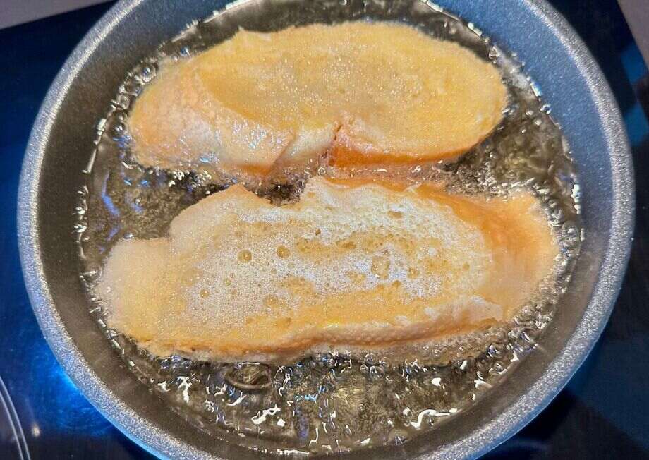 Lightly frying torrijas crisps the exterior, keeping the center soft and custardy.