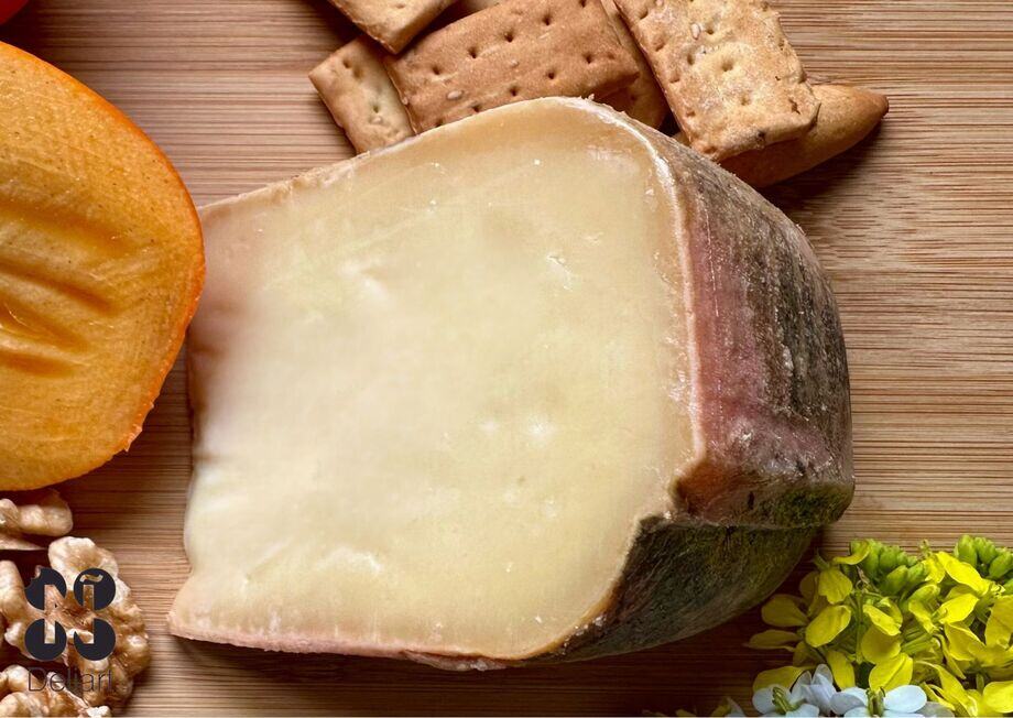 Its unique form, subtly square yet with soft corners, is a nod to the classic Mahon cheese.