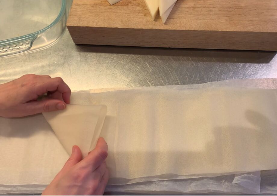 Create triangles by folding dough over cheese.