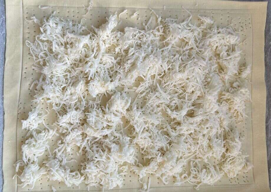Sprinkle cheese over the pastry.