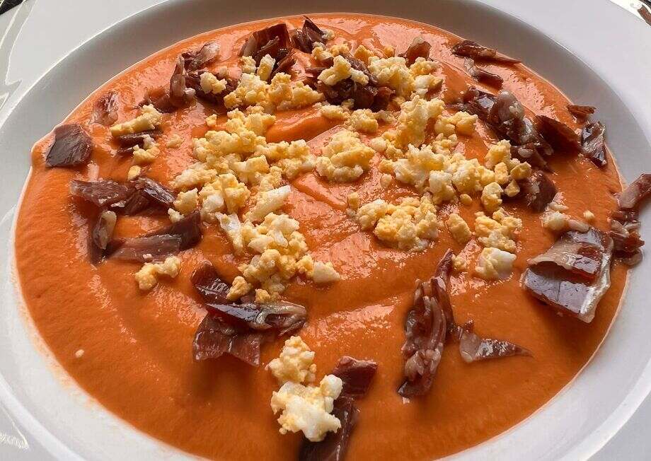 Salmorejo is traditionally garnished with hard-boiled eggs and finely chopped Iberian ham before serving.