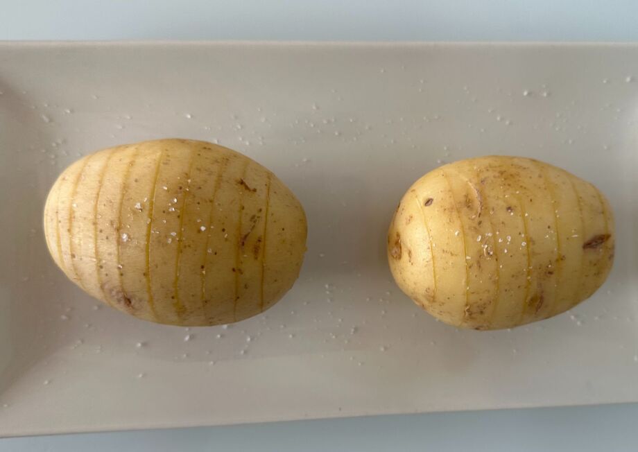 Making cuts in the potato helps ensure uniform baking.