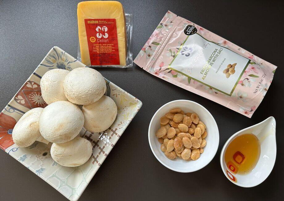 Marcona almonds add a delightful crunch to these Mahon cheese mushrooms.